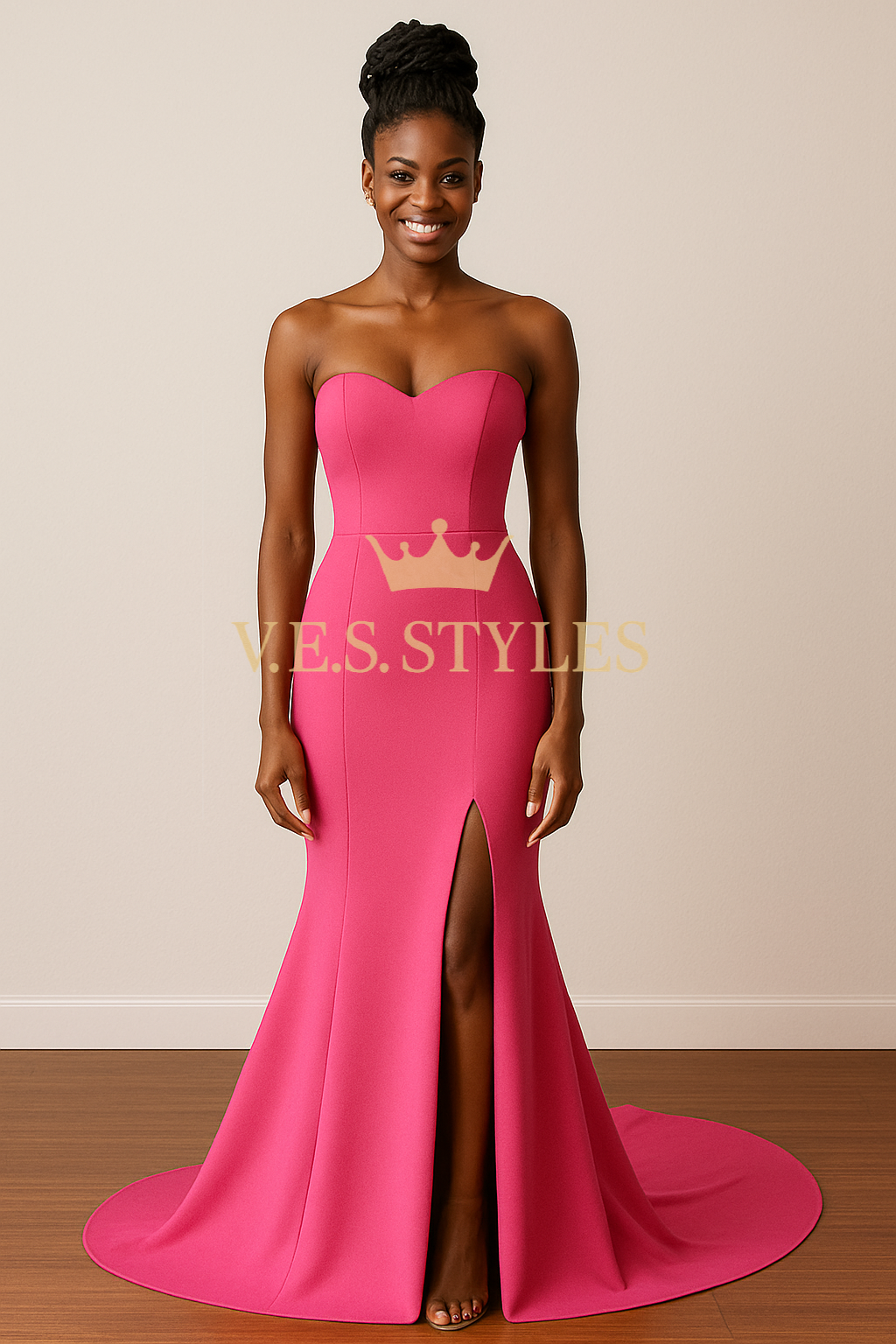 Woman wearing a pink strapless gown with a high slit on a plain background, featuring– V.E.S. Styles