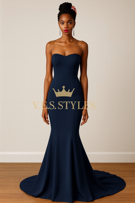 Woman wearing a navy strapless gown mermaid style– V.E.S. Styles
